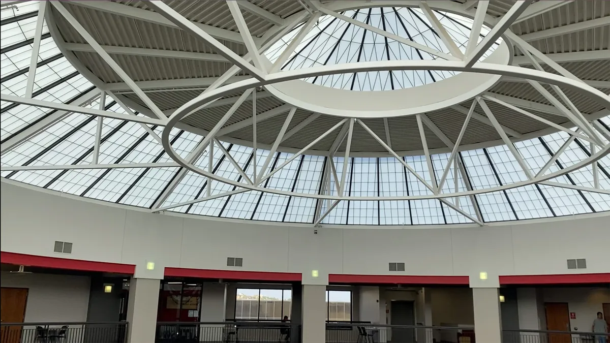 Steel-ribbed domed skylight roof over a building atrium