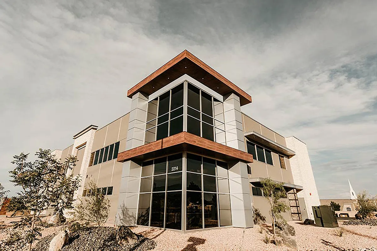 Modern commercial building with a copper-trimmed glass corner